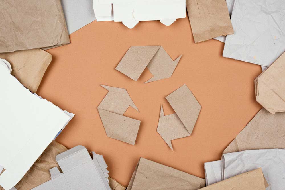 used cardboard boxes stacked in warehouse for wholesale packaging uk