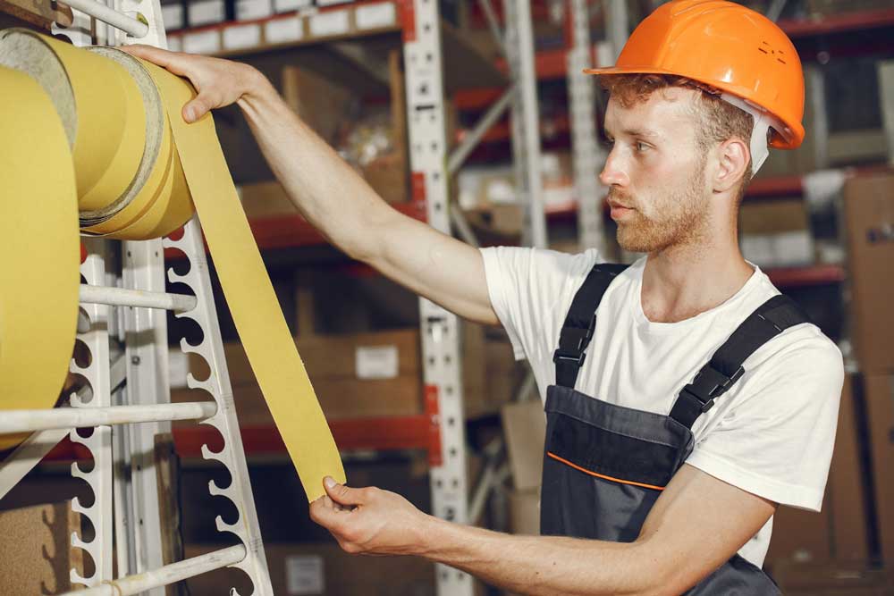 Industrial strapping machine securing palletised goods in a warehouse packaging environment Industrial steel strapping tools and tensioner for heavy-duty packaging applications Industrial pallet strapping machine used in logistics and warehouse operations Industrial packaging strapping solutions for commercial and manufacturing industries Industrial polyester strapping tensioner and sealing tools for pallet security Heavy-duty industrial steel strapping system for transport and load stabilisation Industrial strapping tools and packaging equipment for warehouse distribution centres Automated industrial strapping machine for high-volume packaging operations Industrial packaging machinery and strapping systems used in manufacturing facilities Warehouse worker using industrial strapping equipment to secure shipping pallets